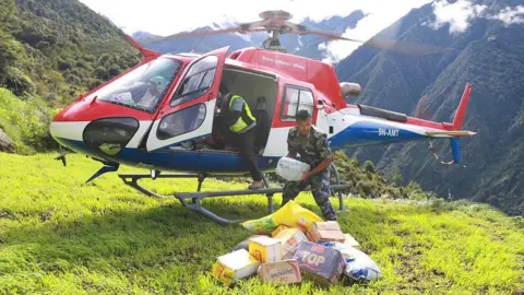 Relief supplies being delivered by helicopter in Nepal